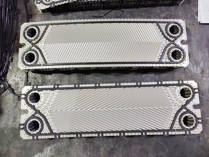 Heat exchanger plate pack before assembly of plate heat exchanger in a factory.